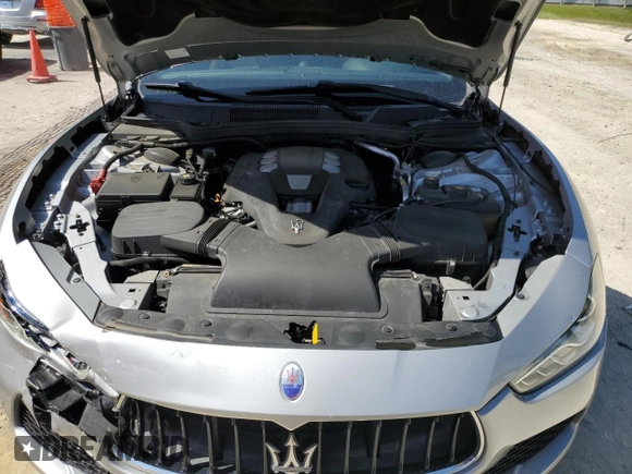 2015 Maserati Ghibli с VIN ZAM57XSA9F1154155, выставлен на аукционе Copart как лот 57093695 с пробегом 63 190 миль миль и Списание • Salvage title. История ставок и продаж доступна на DreamBid. Изображение 11.