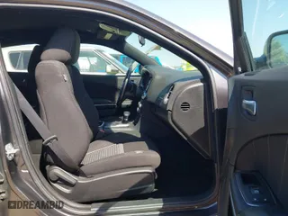 2023 Dodge Charger SXT with VIN 2C3CDXBG4PH515632, listed as a IAAI auction lot 42000682 with 56,163 mi miles. Bid and sale history available at carsss.com. Image 5.