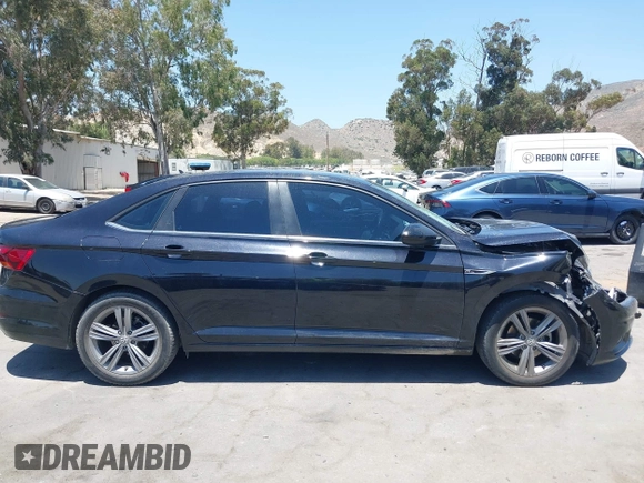 2019 Volkswagen Jetta S z VIN 3VWC57BU1KM116991, wystawiony jako IAAI lot #42377777 z przebiegiem 70 910 mil mil oraz . Historia ofert i sprzedaży dostępna na DreamBid. Obrazek 13.