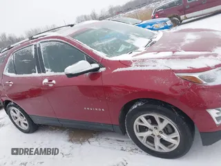 2021 Chevrolet Equinox Premier z VIN 2GNAXXEV4M6105996, wystawiony jako IAAI lot #41402065 z przebiegiem 51 083 mil mil oraz . Historia ofert i sprzedaży dostępna na DreamBid. Obrazek 14.