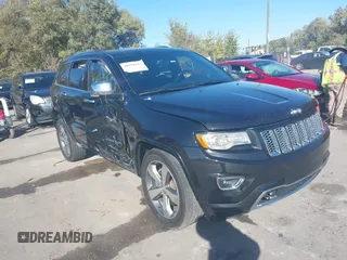 2015 Jeep Grand Cherokee Overland z VIN 1C4RJFCT0FC788993, wystawiony jako IAAI lot #40610312 z przebiegiem 137 133 mil mil oraz . Historia ofert i sprzedaży dostępna na DreamBid. Obrazek 1.