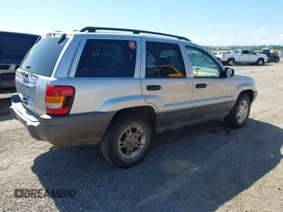 2002 Jeep Grand Cherokee Laredo with VIN 1J4GX48S52C249574, listed as a IAAI auction lot 42458883 with 89,028 mi miles and . Bid and sale history available at DreamBid. Image 4.
