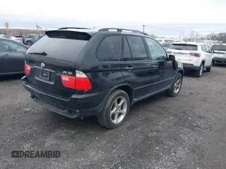 2001 BMW X5 3.0i with VIN WBAFA53501LM71185, listed as a IAAI auction lot 41610473 with 141,322 mi miles. Bid and sale history available at carsss.com. Image 4.