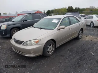 2004 Toyota Camry LE with VIN 4T1BE30KX4U327013, listed as a IAAI auction lot 41987105 with 241,236 mi miles. Bid and sale history available at carsss.com. Image 2.