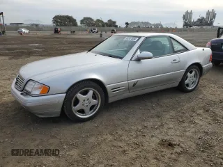 1999 Mercedes-Benz SL-Class with VIN WDBFA68F4XF184335, listed as a Copart auction lot 86287834 with 97,564 mi miles and Salvage Title. Bid and sale history available at carsss.com. Image 1.