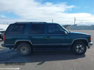 1999 GMC Yukon with VIN 1GKEK13R3XJ717999, listed as a IAAI auction lot 41870187 with 179,855 mi miles. Bid and sale history available at carsss.com. Image 13.