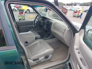 1999 Ford Explorer XLT with VIN 1FMZU34E1XZB72588, listed as a IAAI auction lot 42598441 with 233,717 mi miles and . Bid and sale history available at DreamBid. Image 5.