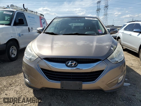 2010 Hyundai Tucson GLS with VIN KM8JU3AC8AU056499, listed as a Copart auction lot 53057365 with 119,906 mi miles and Salvage Title. Bid and sale history available at DreamBid. Image 5.