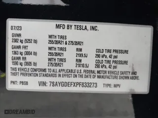 2023 Tesla Model Y Performance with VIN 7SAYGDEFXPF833273, listed as a IAAI auction lot 41892473 with 26,757 mi miles. Bid and sale history available at carsss.com. Image 9.