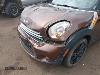 2014 MINI Countryman with VIN WMWZB3C51EWR36737, listed as a IAAI auction lot 41741248 with 69,717 mi miles and . Bid and sale history available at DreamBid. Image 12.