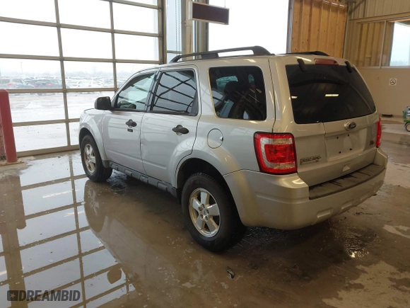 2010 Ford Escape XLT with VIN 1FMCU0D70AKB09942, listed as a IAAI auction lot 41572582 with 218,296 mi miles. Bid and sale history available at carsss.com. Image 3.