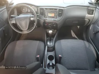 2009 Kia Rio LX with VIN KNADE223296515613, listed as a Copart auction lot 62008194 with 143,238 mi miles and Salvage Title. Bid and sale history available at carsss.com. Image 8.