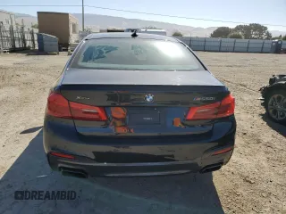 2019 BMW 5 Series M550i xDrive with VIN WBAJB9C50KB464503, listed as a Copart auction lot 56995825 with 67,324 mi miles and Salvage title. Bid and sale history available at DreamBid. Image 6.