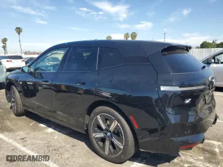 2025 BMW iX xDrive50 with VIN WB523CF05SCT96190, listed as a Copart auction lot 52585415 with 1,894 mi miles and Salvage Title. Bid and sale history available at carsss.com. Image 2.