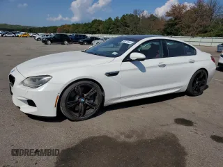 2015 BMW M6 z VIN WBS6C9C5XFD467711, wystawiony jako Copart lot #66574644 z przebiegiem 101 001 mil mil oraz Szkody całkowita. Historia ofert i sprzedaży dostępna na DreamBid. Obrazek 1.