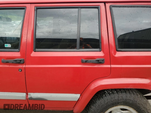 2001 Jeep Cherokee Sport with VIN 1J4FT48S41L570480, listed as a Copart auction lot 56123925 with 216,338 mi miles and Salvage title. Bid and sale history available at DreamBid. Image 11.