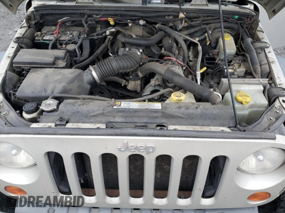 2007 Jeep Wrangler Unlimited Rubicon с VIN 1J8GA691X7L191115, выставлен на аукционе Copart как лот 87523925 с пробегом 85 709 миль миль и Списание • Salvage title. История ставок и продаж доступна на DreamBid. Изображение 12.