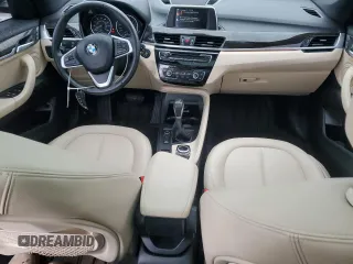 2017 BMW X1 xDrive28i with VIN WBXHT3C3XH5F69573, listed as a Copart auction lot 52719715 with 93,981 mi miles and Salvage Title. Bid and sale history available at DreamBid. Image 8.
