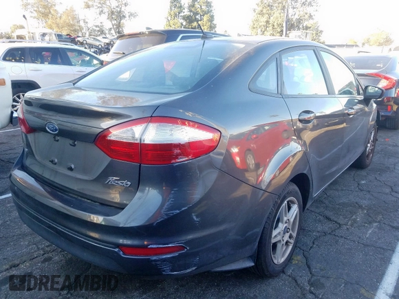 2017 Ford Fiesta SE with VIN 3FADP4BJXHM143529, listed as a Copart auction lot 27313020 with 67,577 mi miles and Salvage Title. Bid and sale history available at carsss.com. Image 4.