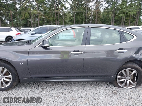 2015 Infiniti Q70 with VIN JN1BY1ARXFM562111, listed as a IAAI auction lot 42473521 with 123,212 mi miles and . Bid and sale history available at DreamBid. Image 14.