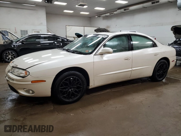2003 Oldsmobile Aurora z VIN 1G3GS64C534171677, wystawiony jako Copart lot #74768254 z przebiegiem 113 932 mil mil oraz Tytuł czysty. Historia ofert i sprzedaży dostępna na DreamBid. Obrazek 1.
