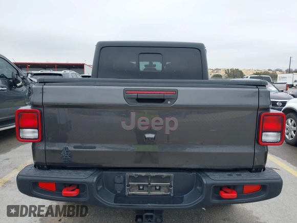 2020 Jeep Gladiator Rubicon with VIN 1C6JJTBG8LL135573, listed as a IAAI auction lot 41585896 with 79,070 mi miles and . Bid and sale history available at DreamBid. Image 16.