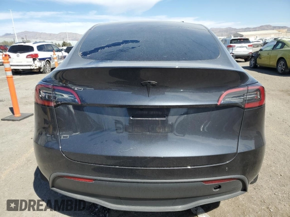 2024 Tesla Model Y Long Range z VIN 7SAYGDEE9RA255805, wystawiony jako Copart lot #50836555 z przebiegiem Nie podano mil oraz Szkoda całkowita • Salvage title. Historia ofert i sprzedaży dostępna na DreamBid. Obrazek 6.