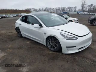 2020 Tesla Model 3 Standard Range Plus with VIN 5YJ3E1EA7LF659172, listed as a IAAI auction lot 42017026 with 32,104 mi miles. Bid and sale history available at carsss.com. Image 1.