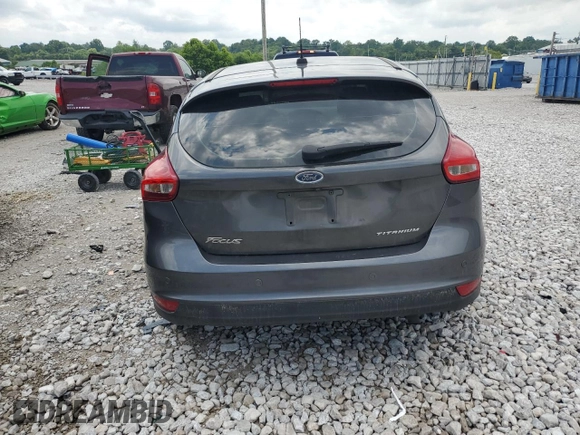 2017 Ford Focus Titanium z VIN 1FADP3N22HL307260, wystawiony jako Copart lot #61399785 z przebiegiem 103 293 mil mil oraz Szkoda całkowita • Salvage title. Historia ofert i sprzedaży dostępna na DreamBid. Obrazek 6.