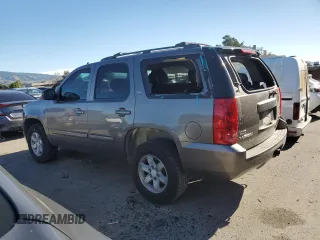 2012 GMC Yukon SLT with VIN 1GKS1CE03CR137258, listed as a Copart auction lot 87684815 with 253,348 mi miles and Salvage Title. Bid and sale history available at carsss.com. Image 2.