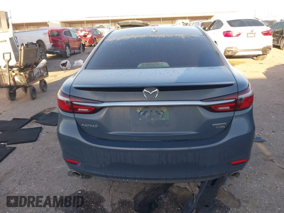 2021 Mazda 6 Carbon Edition with VIN JM1GL1WY9M1619981, listed as a IAAI auction lot 41751194 with 32,083 mi miles and . Bid and sale history available at DreamBid. Image 16.