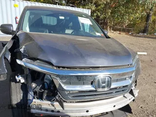 2020 Honda Pilot EX-L z VIN 5FNYF6H53LB069677, wystawiony jako IAAI lot #40581586 z przebiegiem 21 717 mil mil oraz . Historia ofert i sprzedaży dostępna na DreamBid. Obrazek 13.