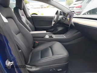 2021 Tesla Model 3 Long Range with VIN 5YJ3E1EB6MF878411, listed as a IAAI auction lot 41986947 with 71,978 mi miles and . Bid and sale history available at DreamBid. Image 5.