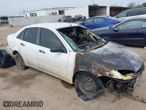 2007 Ford Focus S z VIN 1FAFP34N97W185370, wystawiony jako IAAI lot #41692669 z przebiegiem Nie podano mil oraz . Historia ofert i sprzedaży dostępna na DreamBid. Obrazek 1.
