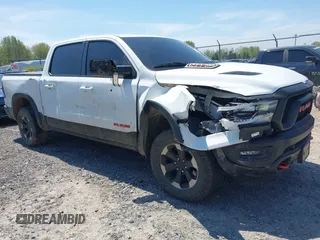 2019 Ram 1500 Rebel z VIN 1C6SRFLT0KN564493, wystawiony jako IAAI lot #42234374 z przebiegiem 86 894 mil mil oraz . Historia ofert i sprzedaży dostępna na DreamBid. Obrazek 1.