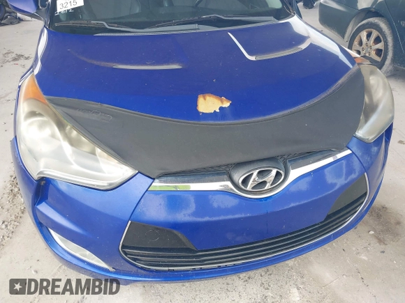 2012 Hyundai Veloster w/Gray Int z VIN KMHTC6AD0CU034683, wystawiony jako IAAI lot #42395112 z przebiegiem 134 388 mil mil oraz . Historia ofert i sprzedaży dostępna na DreamBid. Obrazek 13.