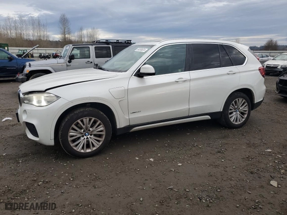 2016 BMW X5 eDrive xDrive40e with VIN 5UXKT0C5XG0S77769, listed as a Copart auction lot 84068624 with 73,710 mi miles and Salvage Title. Bid and sale history available at carsss.com. Image 1.