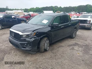 2023 Honda Ridgeline RTL-E with VIN 5FPYK3F77PB052828, listed as a IAAI auction lot 42366947 with 24,658 mi miles and . Bid and sale history available at DreamBid. Image 2.
