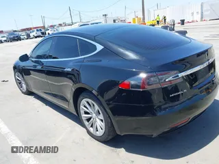 2017 Tesla Model S 60 with VIN 5YJSA1E17HF232699, listed as a IAAI auction lot 42327539 with 113,923 mi miles and . Bid and sale history available at DreamBid. Image 3.