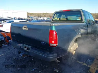 1999 Ford F-150 z VIN 1FTRX18W7XNA40655, wystawiony jako IAAI lot #41445754 z przebiegiem 362 296 mil mil oraz . Historia ofert i sprzedaży dostępna na DreamBid. Obrazek 4.