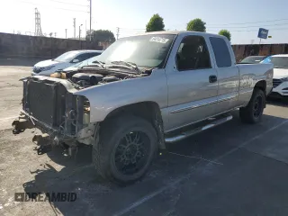 2004 GMC Sierra 1500 SLE with VIN 1GTEK19T54E329675, listed as a Copart auction lot 64314715 with 183,856 mi miles and Salvage title. Bid and sale history available at DreamBid. Image 1.