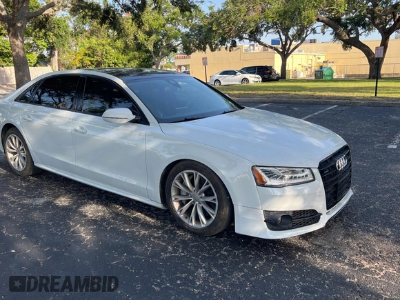 2017 Audi A8 Sport z VIN WAU43AFD7HN005619, wystawiony jako Copart lot #57526015 z przebiegiem 57 262 mil mil oraz Szkoda całkowita • Salvage title. Historia ofert i sprzedaży dostępna na DreamBid. Obrazek 1.