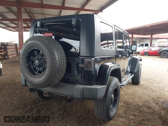 2008 Jeep Wrangler Unlimited Sahara with VIN 1J8GA59128L542384, listed as a IAAI auction lot 42184176 with 152,768 mi miles and . Bid and sale history available at DreamBid. Image 4.