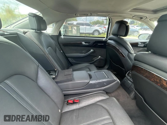 2012 Audi A8 z VIN WAURVAFD6CN015907, wystawiony jako Copart lot #59188515 z przebiegiem 112 879 mil mil oraz Czysty tytuł • Clean title. Historia ofert i sprzedaży dostępna na DreamBid. Obrazek 6.