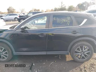 2018 Mazda CX-5 Touring z VIN JM3KFACM3J1435089, wystawiony jako IAAI lot #41130041 z przebiegiem 80 446 mil mil oraz . Historia ofert i sprzedaży dostępna na DreamBid. Obrazek 14.
