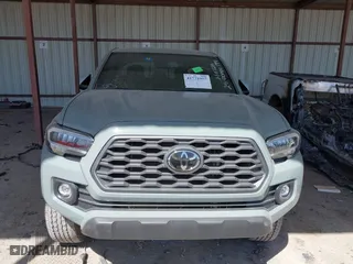 2023 Toyota Tacoma 4WD SR with VIN 3TMCZ5ANXPM613857, listed as a IAAI auction lot 41771957 with 76,232 mi miles. Bid and sale history available at carsss.com. Image 6.