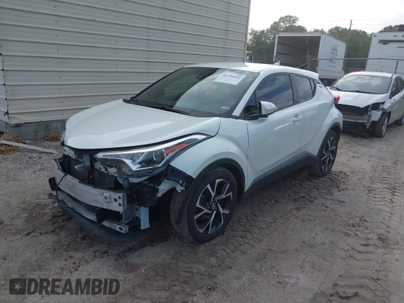 2018 Toyota C-HR XLE with VIN JTNKHMBX3J1010211, listed as a IAAI auction lot 40799443 with 104,148 mi miles. Bid and sale history available at carsss.com. Image 18.