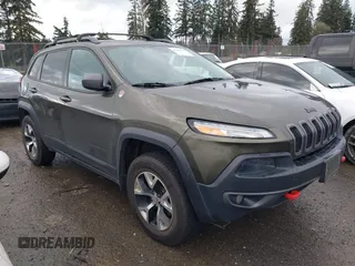 2015 Jeep Cherokee Trailhawk with VIN 1C4PJMBB5FW510514, listed as a IAAI auction lot 41492111 with 98,482 mi miles and . Bid and sale history available at DreamBid. Image 14.