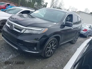 2019 Honda Pilot Touring 7-Passenger z VIN 5FNYF5H66KB027960, wystawiony jako IAAI lot #41863212 z przebiegiem 114 615 mil mil oraz . Historia ofert i sprzedaży dostępna na DreamBid. Obrazek 2.