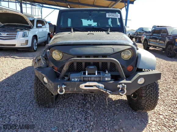 2012 Jeep Wrangler Unlimited Sport with VIN 1C4BJWDGXCL161569, listed as a Copart auction lot 50456355 with 133,703 mi miles and Salvage Title. Bid and sale history available at carsss.com. Image 5.